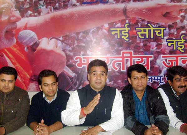 Ravinder Raina,Yuva Morcha State president alongwith other office bearers addressing media persons at party headquarters on Thursday.