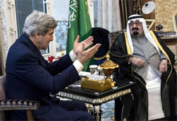 U.S. Secretary of State John Kerry, left, speaks with Saudi Arabia's King Abdullah before their meeting in Rawdat Khurayim, a secluded royal hunting retreat in Saudi Arabia