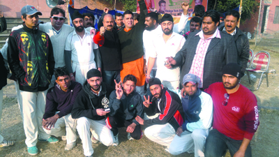 Winners posing for a group photograph during a match of BJYM's 'Khelega Yuva Jeetega Bharat' Cricket Tournament in Jammu.