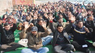 PHE ITI trained workers raising slogans during protest at Jammu on Tuesday. -Excelsior/ Rakesh