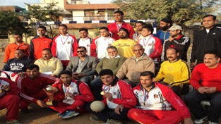 Handball players posing alongwith the chief guest and guest of honour in Jammu on Thursday.