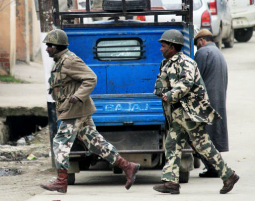 CRPF personnel rush to the spot after militants open fire on a police vehicle at South Kashmir’s Pulwama district on Monday. -Excelsior/ Younis Khaliq