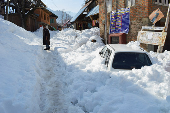 A Maruti car buried under snow in South Kashmir’s Kulgam district after two days heavy snowfall in the Valley. -Excelsior/ Sajad Dar