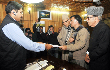 NC candidate Dr. Mehboob Beg with Dr. Farooq Abdullah, and Prof Saif-ud-Din Soz filing his nomination papers for Anantnag Lok Sabha constituency at Deputy Commissioner’s office in Anantnag on Wednesday. —Excelsior/ Amin War