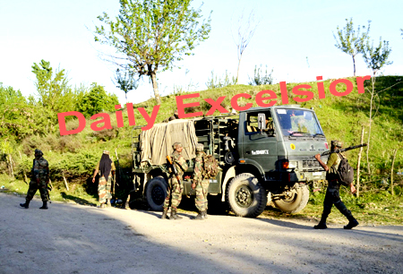 The army soldiers walk during search operation at Shanu in Mawar area of Handwara in north Kashmir after reports of presence of militants PHOTO BY AABID NABI