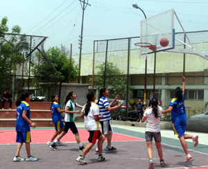 Players sweating-it-out during an Inter-school basketball match in Jammu.