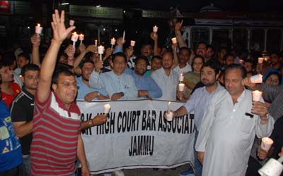 High Court Bar Association members taking out candle march at Jammu on Wednesday. -Excelsior/ Rakesh