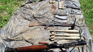 Arms and ammunition recovered from Kupwara forest by Army and police. -Excelsior/ Aabid Nabi