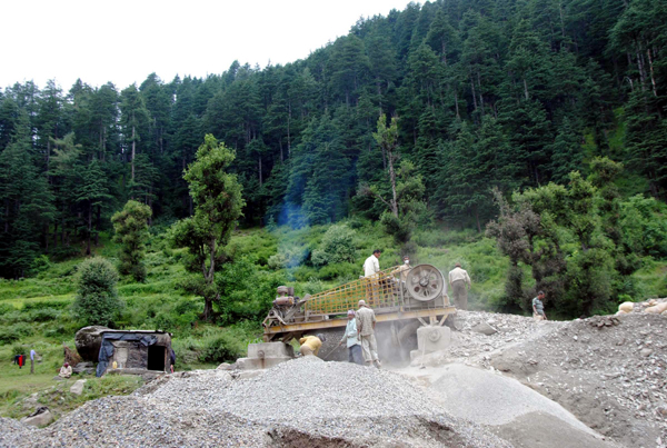 Violating the PCB norms, an illegal stone crusher seen functional near the forest area at Nalthi, 8 km from Bhaderwah town on Tuesday.(UNI)