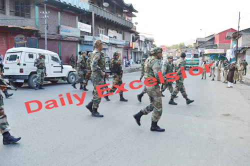 July- 25,2014- ANANTNAG : An army soldiers and policemen inspecting the spot at Bijbehara in south kashmir’s Anantnag district after militants open fire on Mohammad Altaf and killed on the spot in a busy market on Srinagar –Jammu National highway , on Friday. Excelsior / Sajad Dar