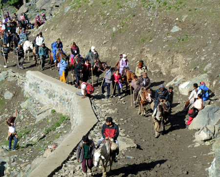 Amarnath pilgrims on their way to holy cave at Sangam Top on Friday. Another pic on page 6. -Excelsior/Sajad Dar