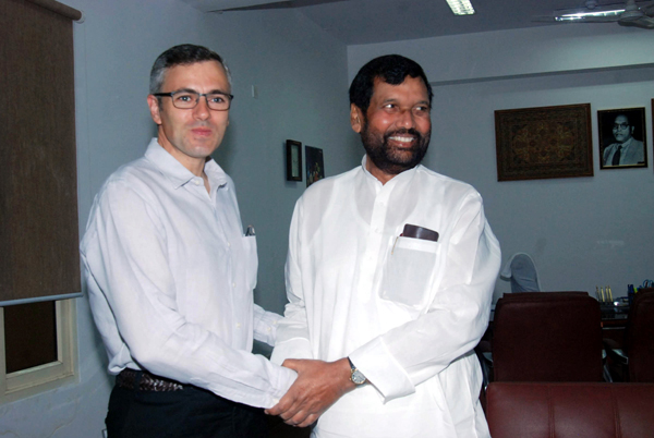 Chief Minister Omar Abdullah with Union Minister for Consumer Affairs, Food and Public Distribution, Ramvilas Paswan, in New Delhi on Wednesday. (UNI)