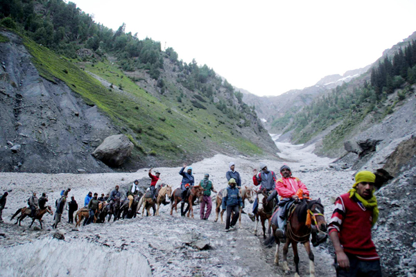 Pilgrims on way to holy cave via Baltal track on Monday. —Excelsior/Sajjad Dar