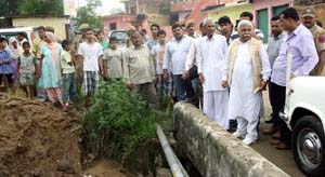 Minister for Planning, Ajay Sadhotra assessing the loss suffered by villagers in Marh block due to flood.