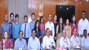 Union Minister Dr Jitendra Singh posing for photograph with IAS toppers of 2013 whose result was declared recently, in New Delhi on Friday.