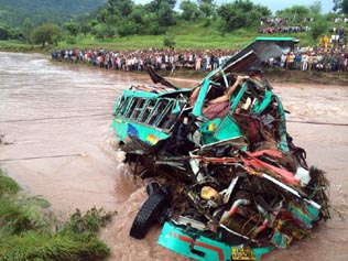 Wreckage of ill-fated marriage party bus which was washed away in flooded nallah in Lam area of Nowshera.