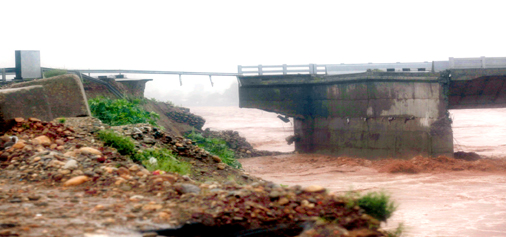 A portion of 4th Tawi bridge at Bhagwati Nagar, Jammu which was washed away in floods on Saturday. -Excelsior/Rakesh