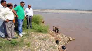 Minister for PHE Sham Lal Sharma taking stock of damages caused by flash floods.