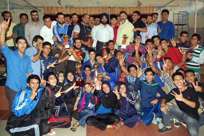 Winners posing along with dignitaries during Inter-District Marshal Arts competition in Kathua.