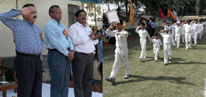 Minister of Science and Technology and Vice President CSIR, Dr Jitendra Singh saluting the march past contingent at Col RN Chopra Cricket Academy in Jammu. — Excelsior/Rakesh