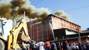 Smoke billowing out of a cold store which caught fire at Narwal on Wednesday. -Excelsior/ Rakesh