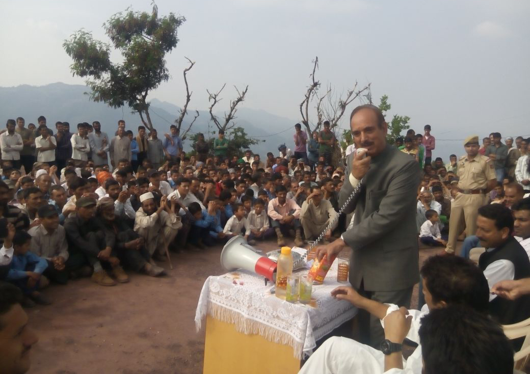 Former Union Minister Ghulam Nabi Azad interacting with flood affected people in Mahore area of Reasi on Wednesday.