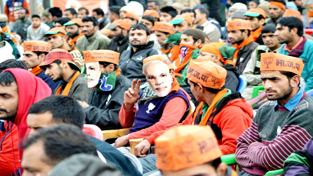 Crowd listening to telephonic speech of Union Home Minister Rajnath Singh at Uri on Friday.