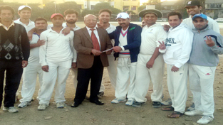 Former chairman and Working Committee Member JKCA, Romesh Mahajan presenting a cash prize to New Challengers Club.