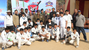 Under-14 cricketers posing along with DIG Jammu, Shakeel Ahmed Beig and other dignitaries in Jammu.