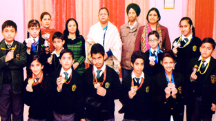 Medal winners in Skating Championship posing along with Principal at DPS Jammu.
