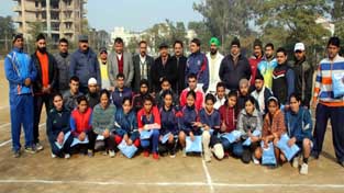 Kabaddi players posing for group photograph with officials of J&K Amateur Kabaddi Association at Jammu on Monday.