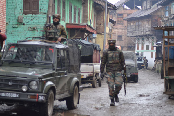 Army soldiers in action during encounter near Sopore on Wednesday. (Another pic on page 10) -Excelsior/Aabid Nabi