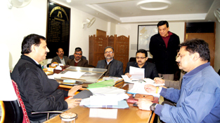Secretary to Government, Satish Nehru with JMC Commissioner and other officers during a review meeting of the civic body on Wednesday.