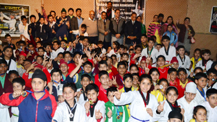 Winners posing for a group photograph during concluding function of Martial Arts Championship in Jammu on Saturday.