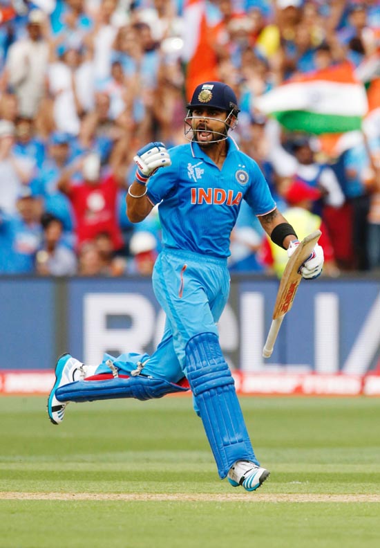 India's batsman Virat Kohli screams as he makes the run which brought up his century during their Cricket World Cup match against Pakistan in Adelaide on Sunday.(UNI)