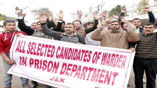 Jail Warden candidates during a protest at Jammu on Wednesday. -Excelsior/Rakesh