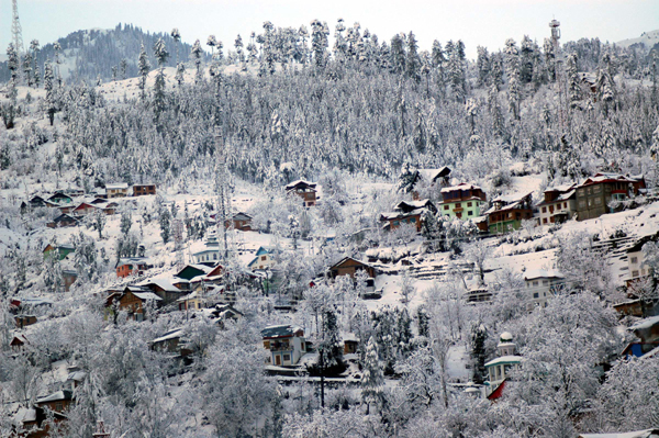A view of snow covered hills in Bhaderwah valley, in Jammu and Kashmir on Tuesday. UNI