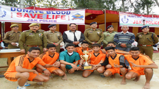 Winners of Volleyball Tournament posing for a group photograph along with the dignitaries at Akhnoor on Wednesday.