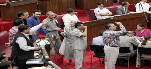 Cong and NC members protesting in the ‘Well’ of State Legislative Council in Jammu on Wednesday. —Excelsior/ Rakesh