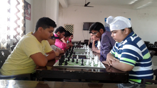 Players in action during Jammu division chess tournaments in Jammu on Saturday.