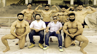 Selected Body Builders posing for a group photograph along with officials.