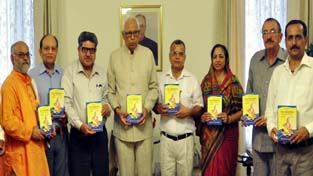 Governor, N N Vohra and others releasing the book of Dr Chandermouli Raina.