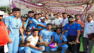 Jubilant team of New Challengers Cricket Club posing along with chief guest, Sham Lal Sharma, former Minister and other dignitaries after clinching JKPL T20 title trophy in Jammu.