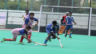 Players displaying dribbling and weaving skills during a hockey match at KK Hakhu Astroturf Stadium in Jammu on Tuesday. –Excelsior/Rakesh