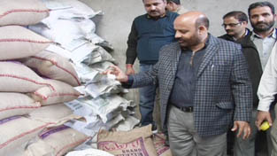 Minister for Social Welfare, Bali Bhagat conducting checking of ICDS store at Zaldagar on Wednesday.