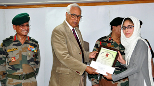 Governor N N Vohra felicitating meritorious student of APS Srinagar.