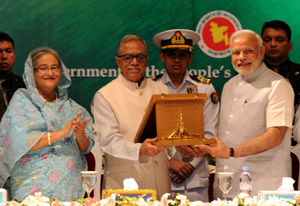 Prime Minister, Narendra Modi being received the Award of Bangladesh Liberation War Honour on behalf of former Prime Minister, Atal Bihari Vajpayee, in Dhaka, Bangladesh on Sunday.