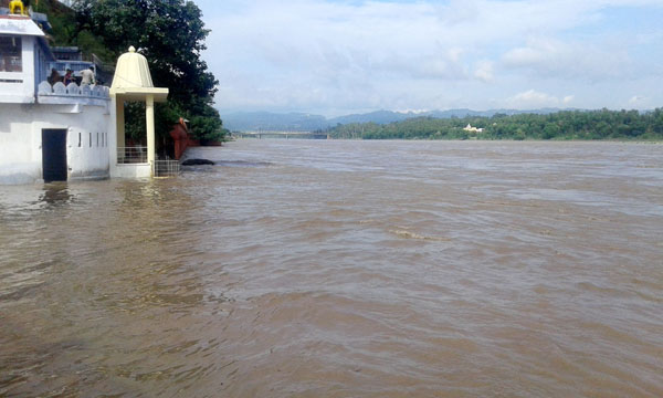 A portion of temple submerged in flood as Chenab flows at danger mark in Akhnoor on Sunday.