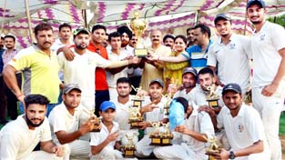 Minister of State for Education, Information and Culture Priya Sethi along with Yudhvir Sethi presenting 3rd Jammu Tawi Summer T-20 Cup to JCC team at GGM Science College cricket ground on Sunday.