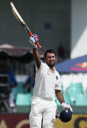 Cheteshwar Pujara celebrating his century during the second day of third and final test cricket match against Sri Lanka in Colombo on Saturday. (UNI)